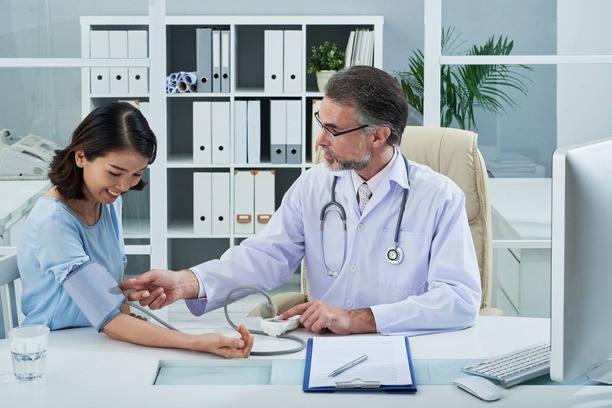 Doctor examining a woman for health and security check